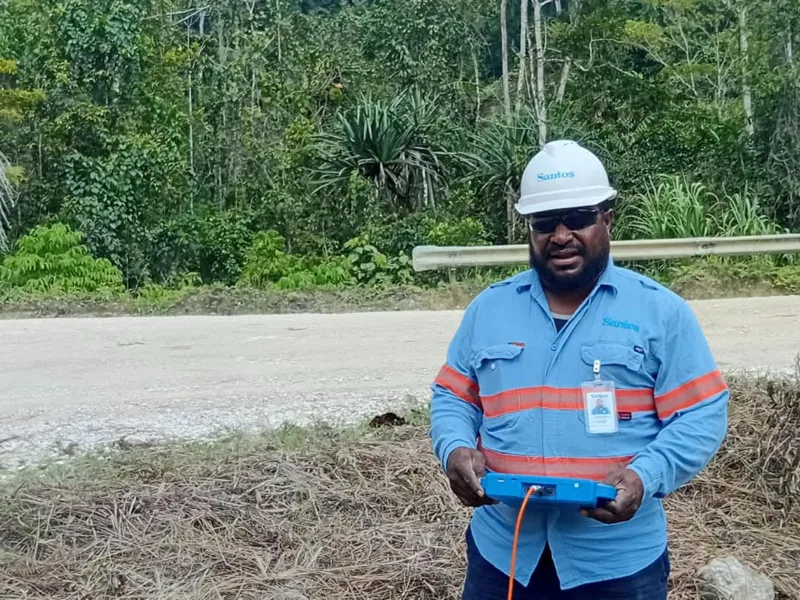 Survey team member holding field equipment